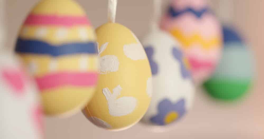 Colorful painted easter eggs hanging, selective focus