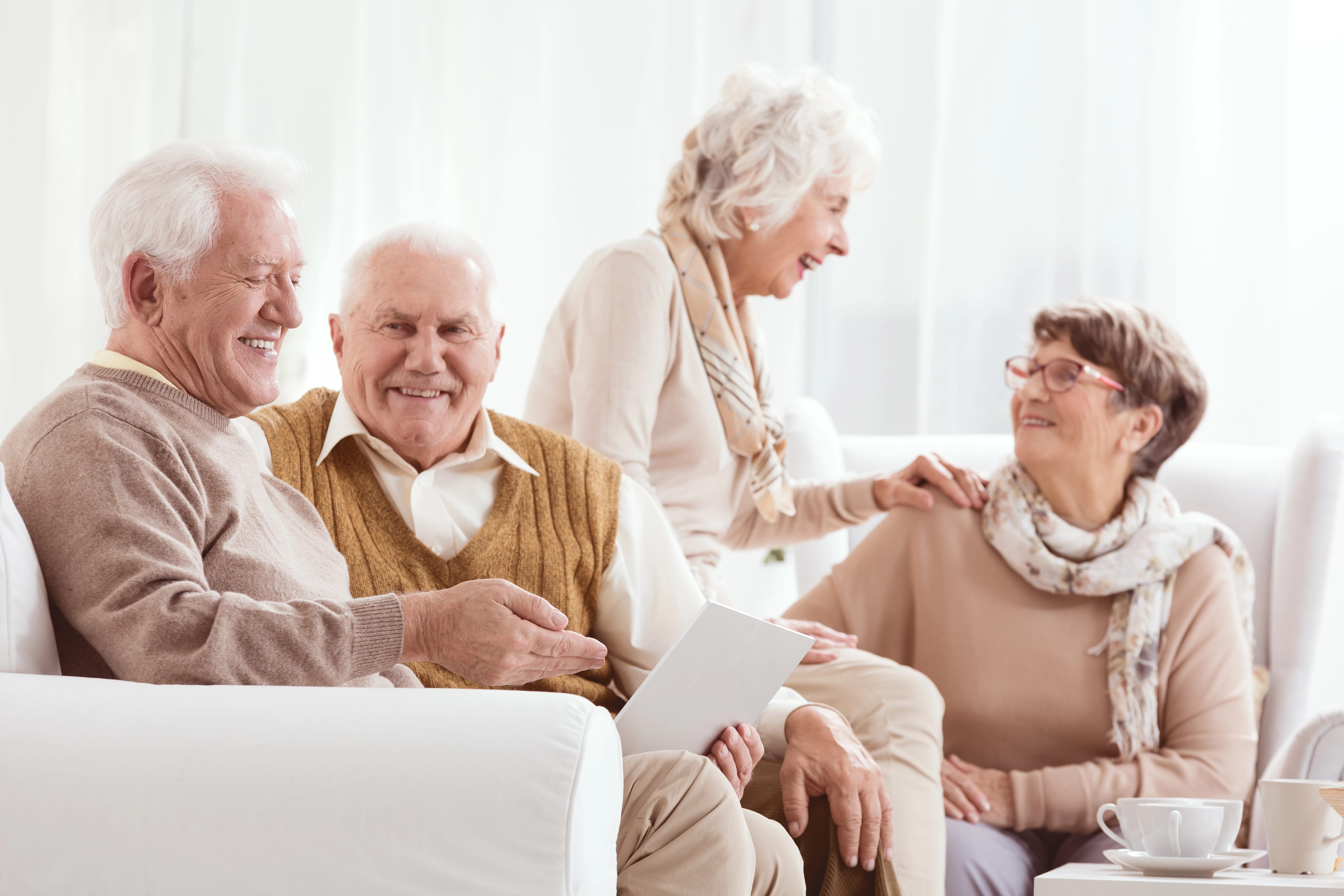 Four smiling senior friends